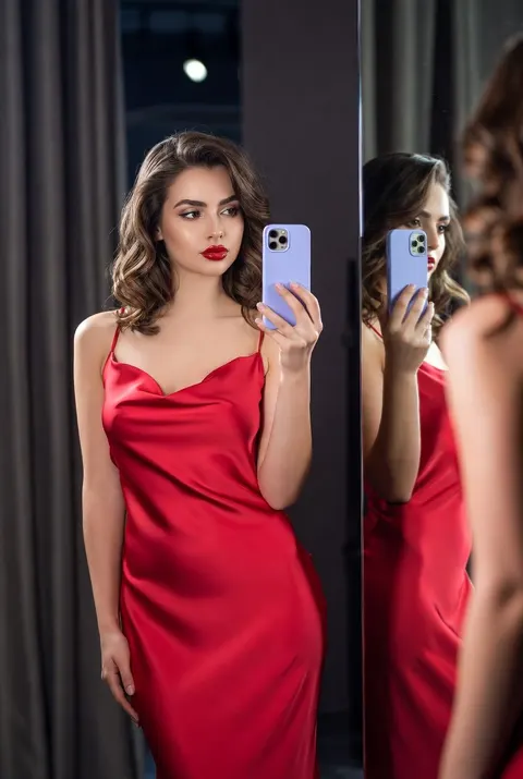 Dressing room red satin mirror selfie prompt