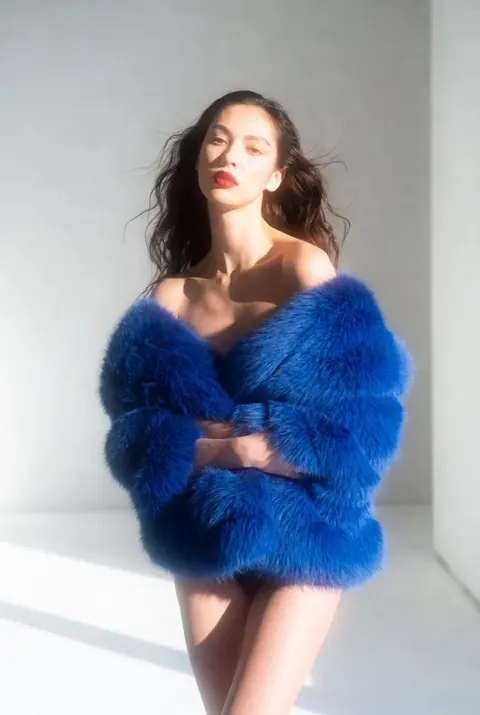 Electric blue faux fur Vogue editorial prompt